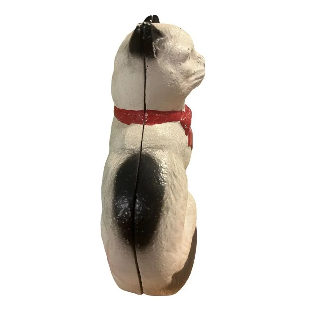 Retro cast iron cat with red bow penny bank by John Wright